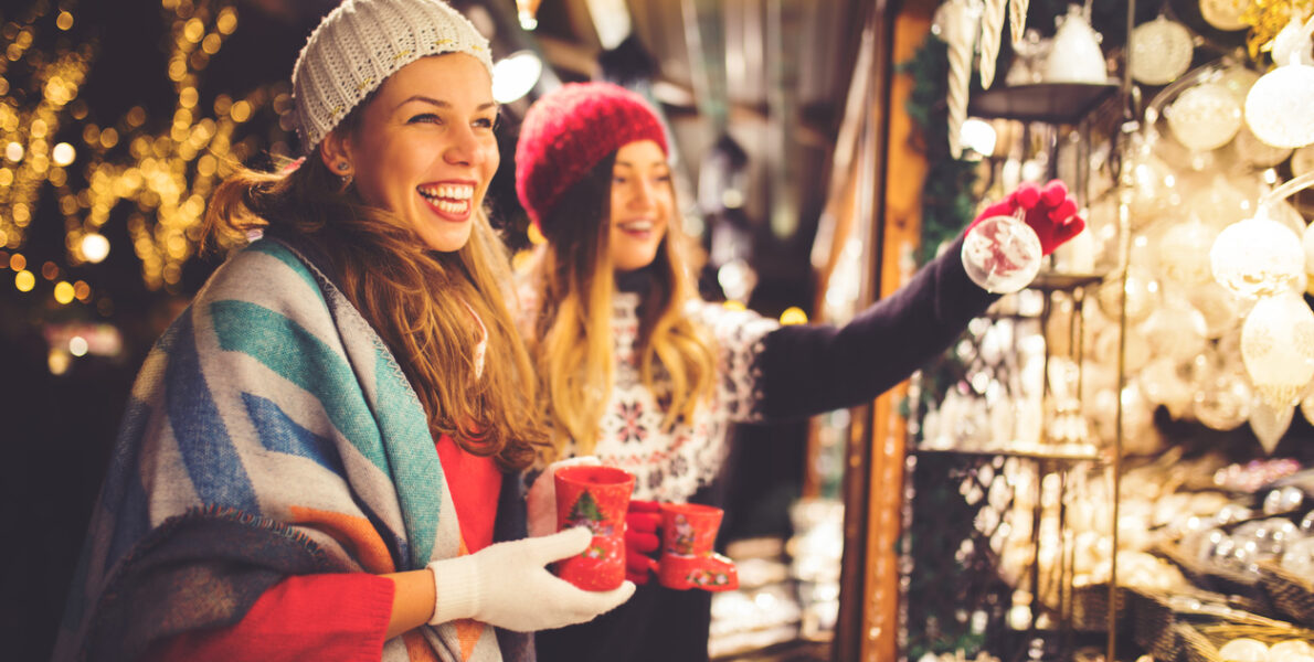 Women enjoying a Christmas Market booth